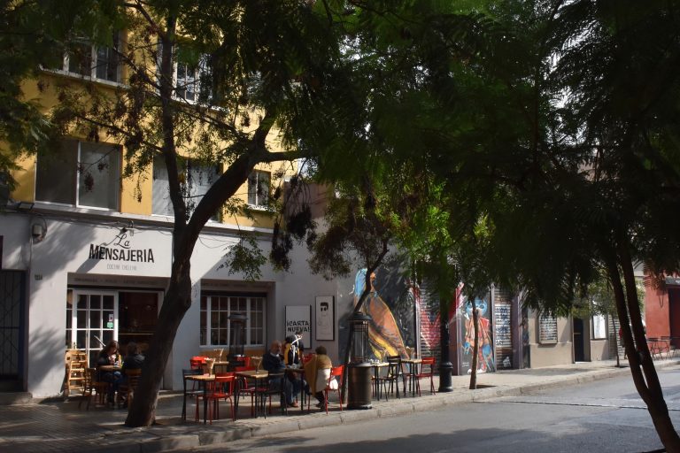 street with trees and cafes in Lastarria